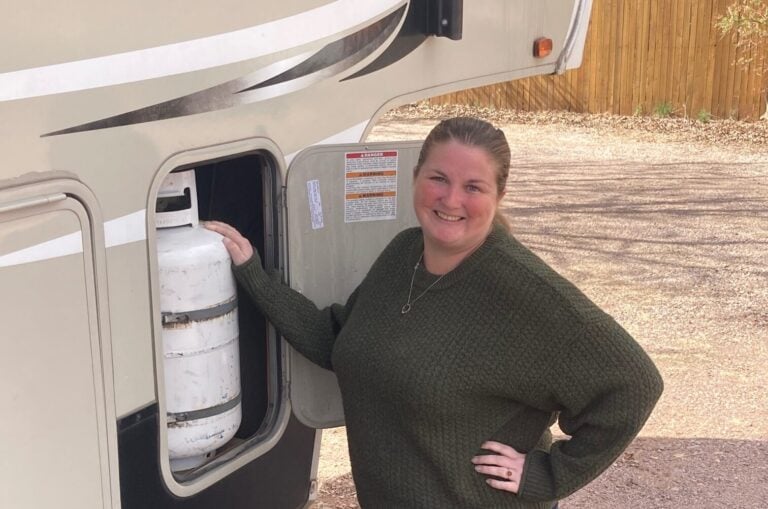 Woman turning off RV propane tank