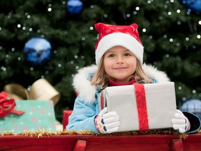 Girl carrying Christmas Gift