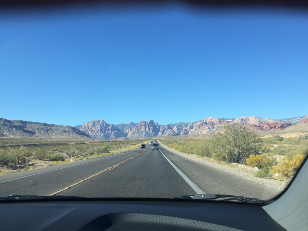 View of road and mountains through windshield