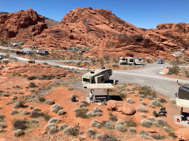 Aerial photograph of RV park surrounded by red rocks.