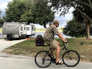 Dog riding in bike basket at RV Park