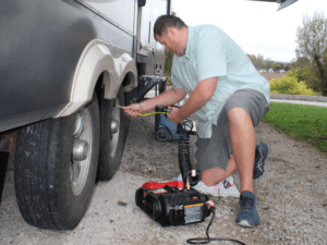 Man airing up RV tires