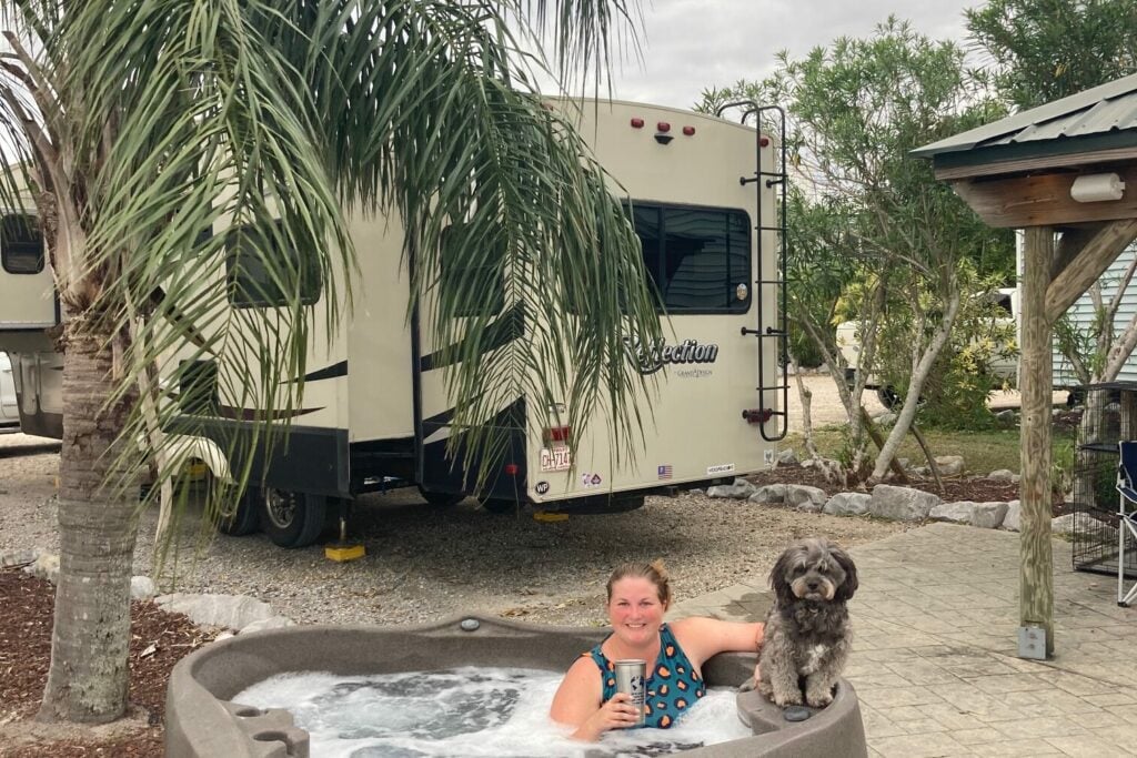 Woman in private hot tub at RV park.