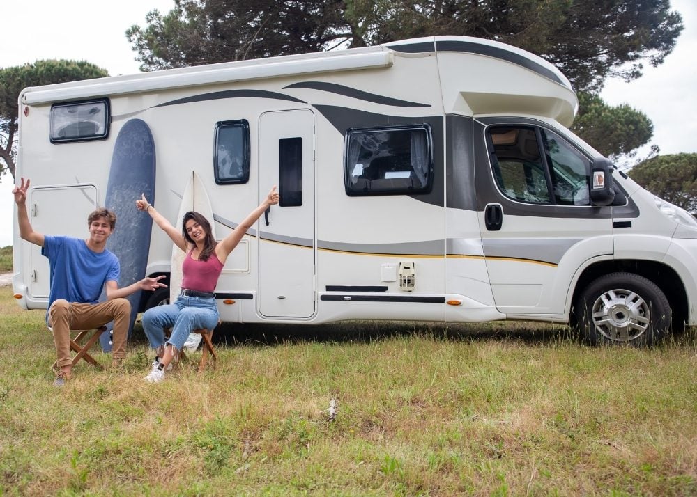 Couple happy at RV campsite.