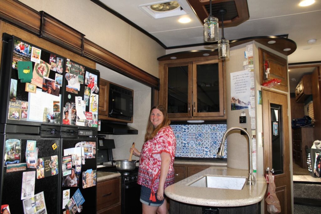 Woman cooking in RV Kitchen