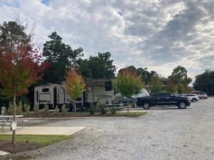 RVs parked at RV park with concrete pads.