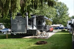 Luxury RV Resorts in Michigan. Campsite with Toy Hauler RV at Vacation Station RV Resort.