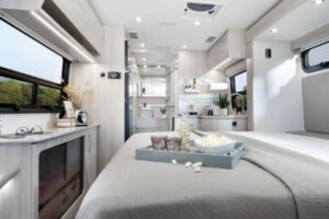 Unity small luxury RVs. Interior with murphy bed folded down. 