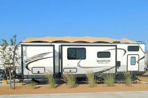 RV with roof cover on top.