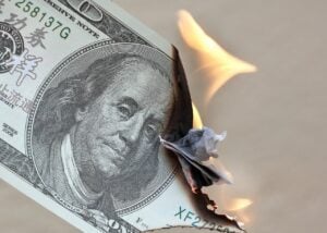 Dollar bill on fire.