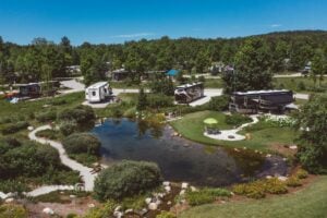 Luxury RV Resorts in Michigan. Spacious campsites surrounding pond at Indigo Bluffs RV Resort.