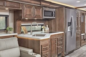 Kitchen inside a Super C RV.