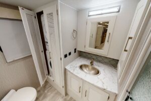 RVs with a washer or dryer in white bathroom.