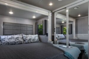 Bedroom inside a luxury fifth wheel RV.