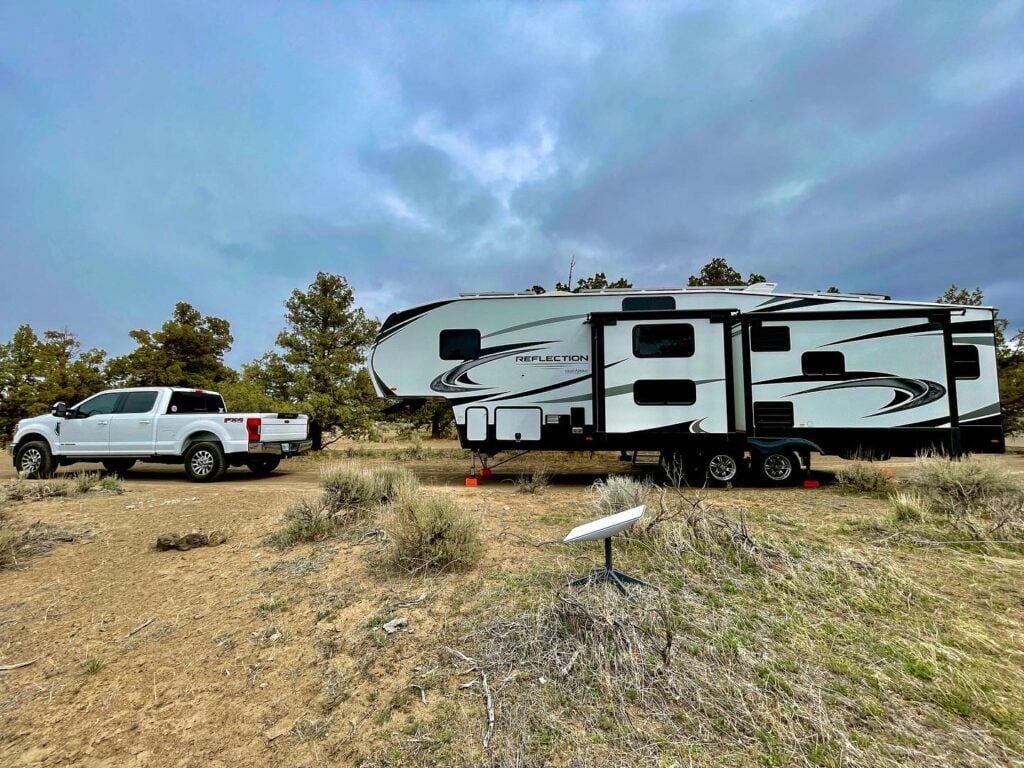 Fifth wheel RV with Starlink internet dish.