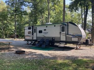 Travel trailer parked at COE campground.