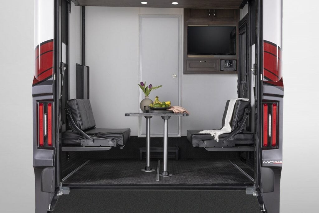 Garage in Class A Toy Hauler set up for dining.