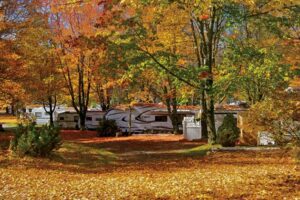 Best RV Parks in New England. RV campsites under fall foliage at Silver Lake.