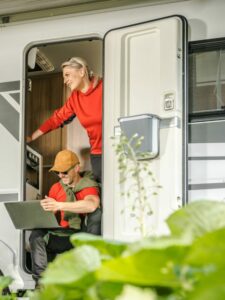 Couple in RV doorway.