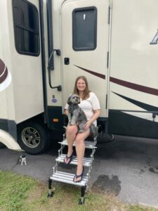 Woman with Dog on RV Steps