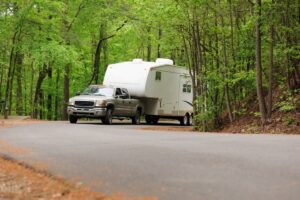 Fifth wheel RV being towed by truck