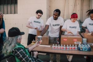 Volunteers passing out food.