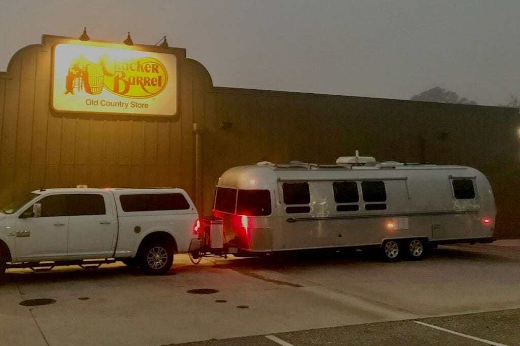 RV parking at Cracker Barrel at night.