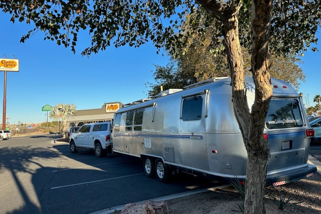 Airstream RV parked at Cracker Barrel parking lot.