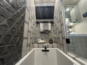 Bathtub with TV above inside RV
