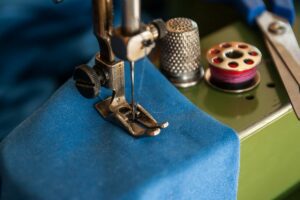 Blue fabric in sewing machine