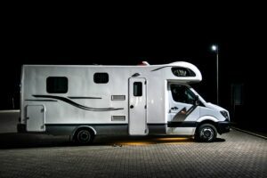 RV stealth camping in parking lot at night