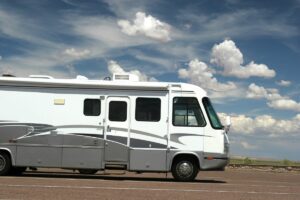 RV parked in parking lot.