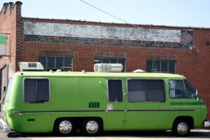 Vintage RV parked on city street