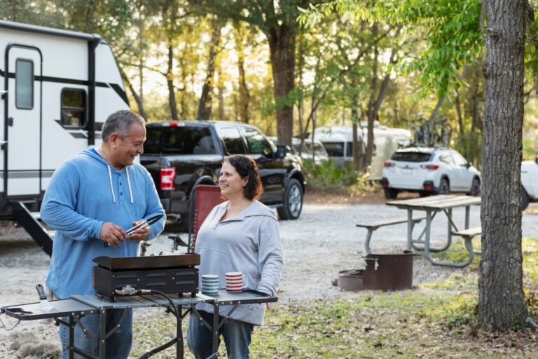 Couple Grilling at RV Campsite