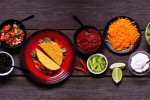 Taco bar on picnic table.
