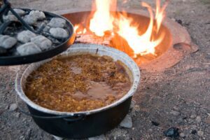 Taco beef cooking in Dutch oven.