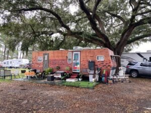 RV with custom exterior paint that resembles bricks.