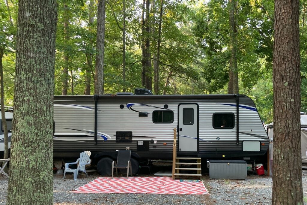 Travel Trailer RV with Red Patio Mat
