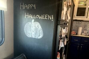 Chalkboard wall in RV decorated for Halloween.