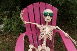 Camper Halloween Decoration Ideas: Plastic Skeleton in Camping Chair.