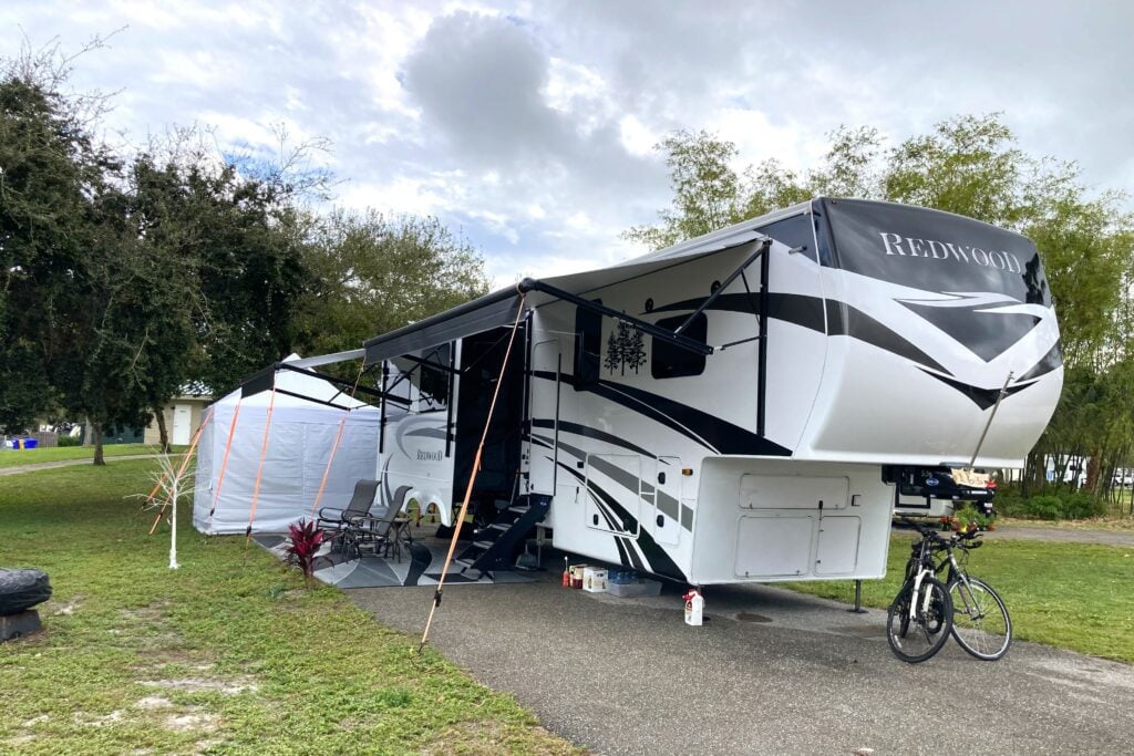 Luxury fifth wheel RV at RV park.