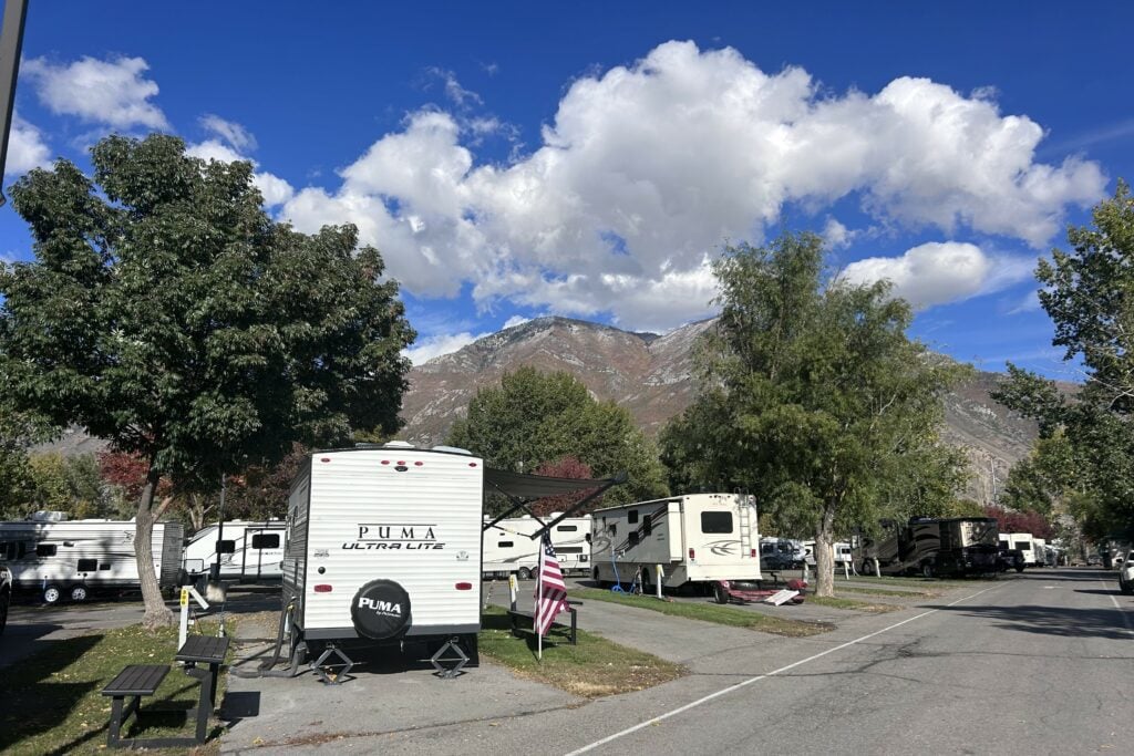 RV parked at RV park with mountain in background