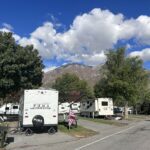 RV parked at RV park with mountain in background