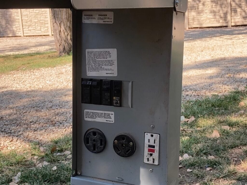 RV campground power pedestal with 30-amp and 50-amp outlets.