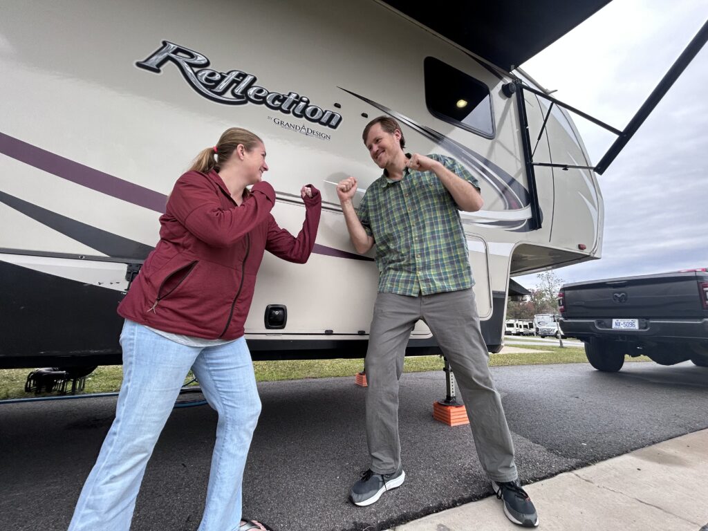 RV couple play fighting.