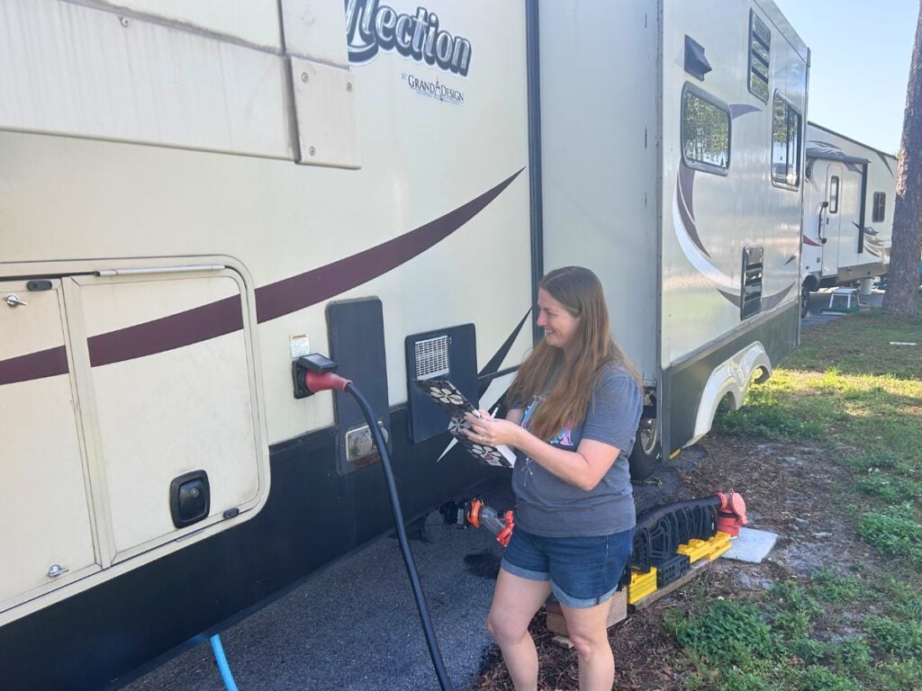 Woman using RV travel day checklist