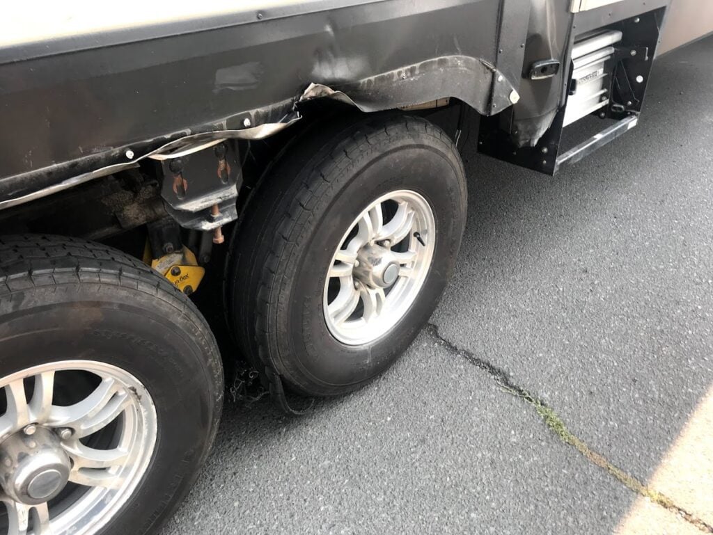 Damaged RV with blown tire