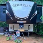 RV with slides extended and slide toppers