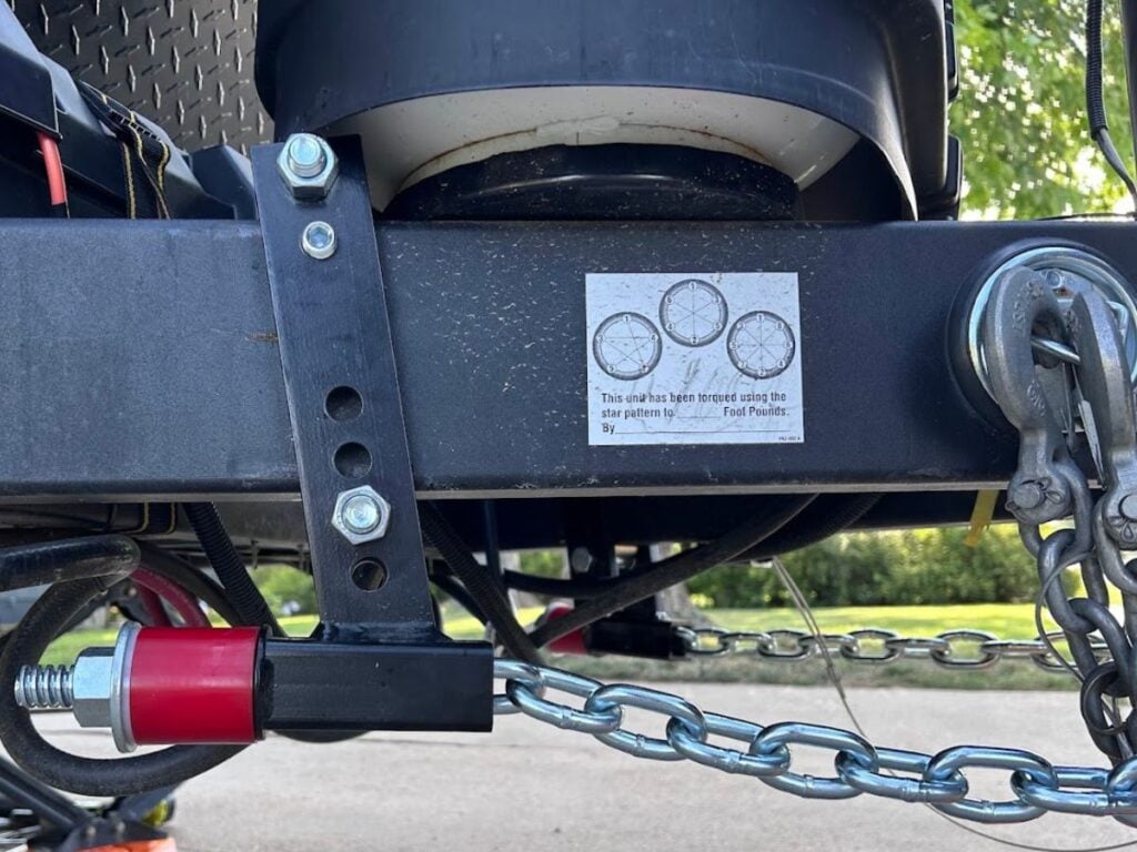 Close up of Andersen weight distribution hitch chain and tension nut.