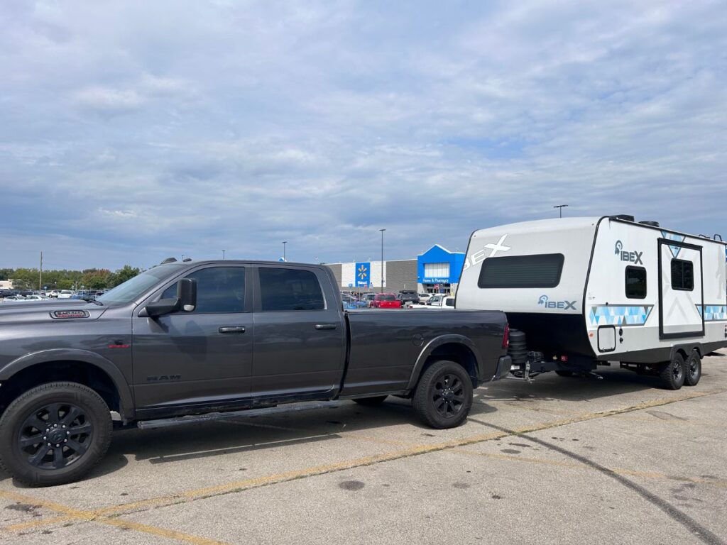 Travel Trailer RV in Walmart parking lot.